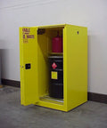Hella Durable 60 Gallon Fireproof Flammable Storage Cabinet For Hazardous Waste featuring dual doors and a black waste drum inside.