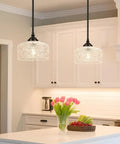 Adjustable Black Vintage Pendants With Ninety Degree Swivel Heads For Kitchen Islands And Bedrooms Offering Height Range That Kills Annoying Glare And Delivers A Killer Farmhouse Vibe Worth Buying in kitchen with floral arrangement.