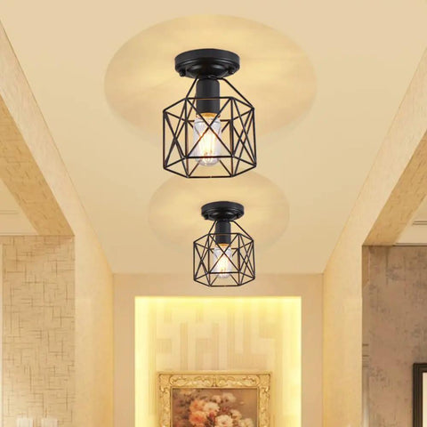Retro Black Industrial Ceiling Light Fixture Mini Metal Rustic Flush Mount illuminating a hallway with warm light