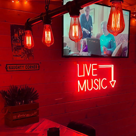 Live Music Neon LED Sign Handcrafted Wall Decor Light 17 By 11 Inches glowing red in a dimly lit bar with decor.