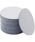 Grab This Awesome 100 Piece Set Of 5 Inch Wet Dry Sanding Discs With Grit From 60 To 1000 For Serious Polishing And Grinding Jobs Without Wasting Time Or Clogging Up Your Gear So You Can Get That Smooth Finish Fast. Stack of grey 5 inch sanding discs.