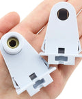 No Fuss T8 Tombstone Sockets 2 Pack White Non Shunted Lampholder Connectors held in hand for fluorescent fixture upgrades.