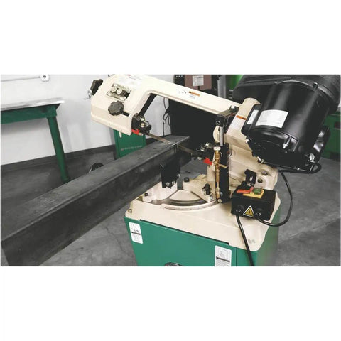 Badass Metal Cutting Bandsaw With Swivel Head And Five By Six Inch Cutting Capacity Powered By Rock Solid Half Horsepower Motor Running Clean On 110V Or 220V For Smooth Shop Chores