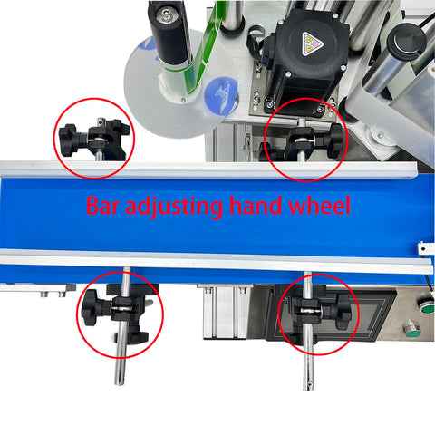 Top view of High Capacity Automatic Labeling Machine For Round Bottles with bar adjusting hand wheels.