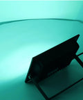 SUNGOOYUE LED Flood Light RGBW Color Changing illuminated in green, showcasing sleek aluminum design and stand.