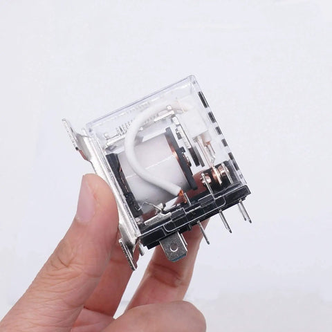 Close-up of hand holding a Beefy 12V DC Coil Relay With DPDT 30A 2NO 2NC 8 Pin Heavy Duty General Purpose Relay for power switching.