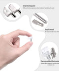 Close-up of hand holding a nickel plated pin from the Six Styles Shelf Pins Set With 160 Pieces Nickel Plated Cabinet Pins For 5mm And 6mm Shelf Holes.