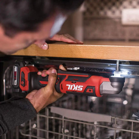 Two Tool Cordless Drill And Right Angle Impact Kit with 12V Brushless Power being used under a kitchen counter