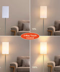 3-Way Dimmable Touch Floor Lamp with marble base, brushed nickel, square linen shade showing four brightness settings next to couch.