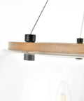 Close-up of wood accent and clear glass shade on Orono 3 Light On Trend Modern Farmhouse Black Pendant Ceiling Light