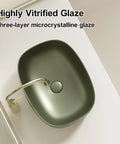 Retro Green Ceramic Above Counter Bathroom Vessel Sink, Artistic Curved Design, Scratch-Resistant & Easy-to-Clean Vanity Sink for Home, Balcony, Guest Bath (23.6in/60cm) with highly vitrified glaze.