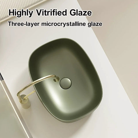Retro Green Ceramic Above Counter Bathroom Vessel Sink, Artistic Curved Design, Scratch-Resistant & Easy-to-Clean Vanity Sink for Home, Balcony, Guest Bath (23.6in/60cm) with highly vitrified glaze.
