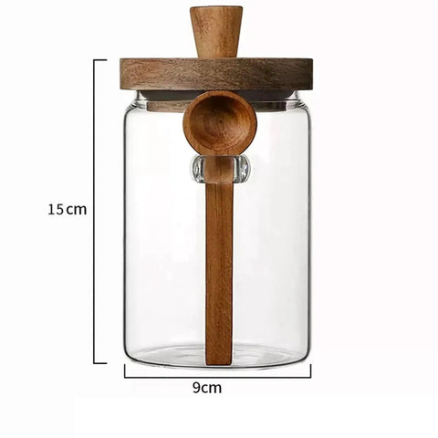 Go Ahead And Upgrade Your Countertop Setup With This Solid Clear Glass Storage Jar Featuring An Airtight Sealed Kitchen Canister And Wooden Spoon For Coffee Beans 900Ml Capacity Handles Dry Goods Smoothly And Looks Dope. 15cm tall glass jar with wooden lid and spoon.
