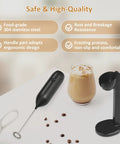 Rechargeable USB Type C Milk Frother Handheld With Stand Powerful Electric Foam Maker on table with coffee cup and stand.