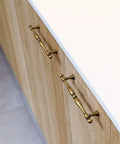 Six Pack Antique Brass Cabinet Pulls With 7.6 Inch Hole Center installed on wood cabinet drawers.