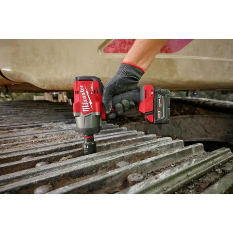 Half Inch High Torque Cordless Impact Wrench Kit With Friction Ring Brushless Workhorse Professional Grade 18 Volt Battery And All Day Carry Bag For Real Shop Hustle used on textured metal surface.