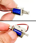 Close-up of Tiny 12V Micro Push Pull Solenoid Electromagnet, ultra compact linear actuator, open frame design with metal build, 4mm stroke.