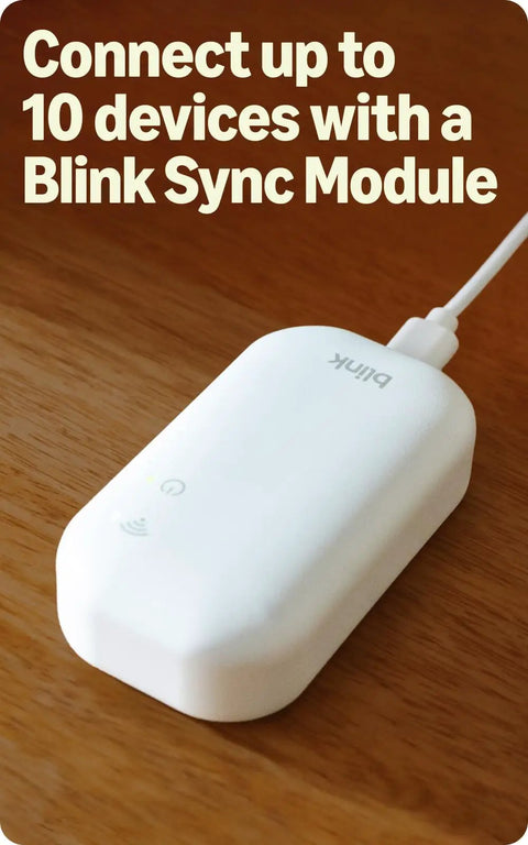 Level Up Your Home Security Game With This Black Outdoor Wireless Camera delivering a white Blink Sync Module for device connectivity.