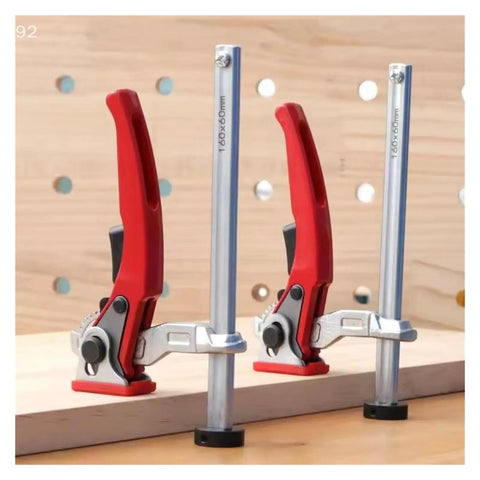 20mm Quick Press Hold Down Clamp with Ratchet Locking Mechanism on wooden workbench, three clamps engaged
