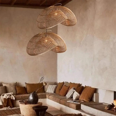 YAXDQUW Irregular Shaped Rattan Pendant Light Hand Woven Wicker Hanging Ceiling Lamp Adjustable Cord in cozy living room setting.
