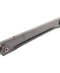 Rear suspension control arm, side view; gray metal with bushings at both ends.