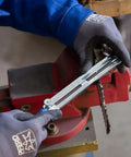 Person using Chainsaw Sharpening Files Set CS SLS 4.0 In Roll Bag, 4 mm Diameter, on chainsaw chain mounted in vice.