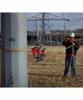 Milwaukee M18 1-75 Inch Cordless Magnetic Drill Press Kit With 5.0 Ah Battery And Charger suspended from a pole on a construction site.