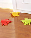 4 Piece Leaf Shape Door Stopper Finger Protector Set Made From Durable PP Material on wooden floor