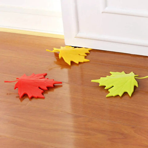 4 Piece Leaf Shape Door Stopper Finger Protector Set Made From Durable PP Material on wooden floor