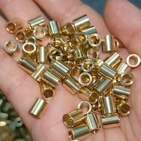 Ten Piece SMT Soldering Copper Nuts And Precision Bearing Sleeves For PCBs Threaded Through Hole welded brass hardware in hand.