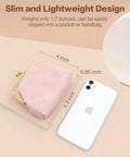 Totally Adorable Vintage Coin Purse For Women Super Chic Mini Leather Change Pouch With Secure Kiss Lock Clasp on display with phone.