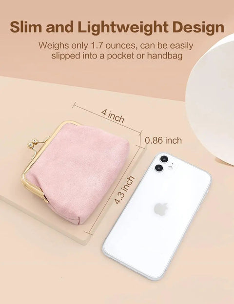 Totally Adorable Vintage Coin Purse For Women Super Chic Mini Leather Change Pouch With Secure Kiss Lock Clasp on display with phone.