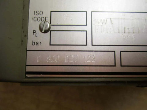 Directional control valve 0 820 027 128 solenoid, housing detail showing part number, for industrial hydraulic systems.