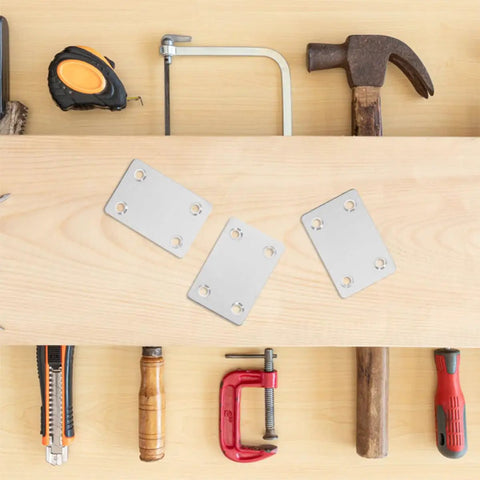 Stainless Steel Flat Corner Bracket Set 30 Pcs With 19mm And 42mm Hole Spacing on wooden table with tools around