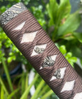 Close-up of sword handle tsuka with real samegawa stingray skin and alloy copper iron fittings dope grip for authentic samurai look