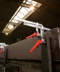 Heavy Duty 20 Inch Lever Clamp With Quick Grab Ratchet Jaw Dead Nuts Cold Drawn Steel Frame on a metal workpiece in workshop.