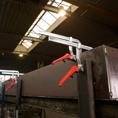 Heavy Duty 20 Inch Lever Clamp With Quick Grab Ratchet Jaw Dead Nuts Cold Drawn Steel Frame on a metal workpiece in workshop.