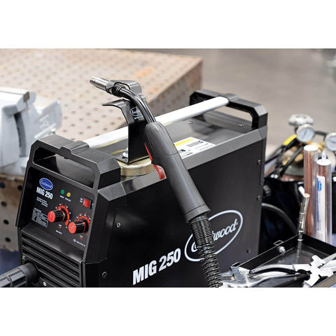 Magnetic MIG Welder Torch Holder Heavy Duty 3mm Steel Powder Coated Finish 2.75in Grippy Magnet in use on welding machine