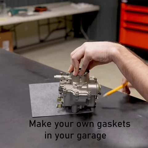 HTJZWG gasket making material sheet; hand places a carburetor on a gray gasket sheet in a workshop.