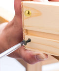 Person using a screwdriver on Top Shelf Vintage Style Brass Screws With Flush Caps, Self Tapping Decorative Fasteners For Antique Cabinets And Wooden Boxes, Straight Up 15mm Gold Finished Hardware Pack Of 16.