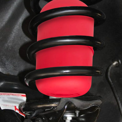 Rear air suspension spring bag, red rubber with black coil, installed on vehicle.