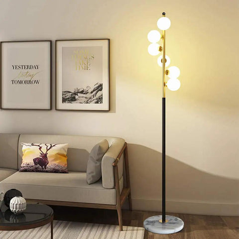 White Glass Shade Marble Base Floor Lamp With Six LED Bulbs Included Modern Mid Century Style That Brings Lit Ambience To Living Room Bedroom Office Tall 62 Inch Standing Lamp Warm White 2700K Easy On Off Switch in a living room setting