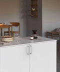 Modern kitchen island with 10 Pack 5 Inch Cabinet Handles Brushed Satin Nickel Zinc Alloy Pulls for cupboards in a cozy setting.