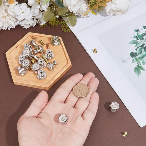 16 Piece Vintage Silver Flower Embossed Drawer Knobs For Kitchens And Dressers Compact Round Metal Pulls With Matching Screws on display with a coin.