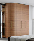 Modern bedroom with wooden wardrobe featuring sleek metal handles