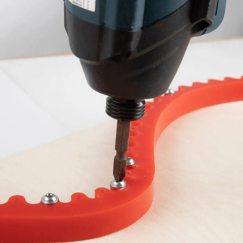 78 Inch Flexible Curve Guide Router Template No Sweat Shaping For Trimming Odd Shapes And Complex Contours Dead On Precision Polyurethane being used with a drill.