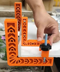 Killer Adjustable Seven Piece Right Angle Clamp Set Lightweight ABS Plastic Corner Clamping Kit For Smooth Woodworking Picture Frame And Cabinet Drawer Assembly Projects Orange Color displayed on a workspace.