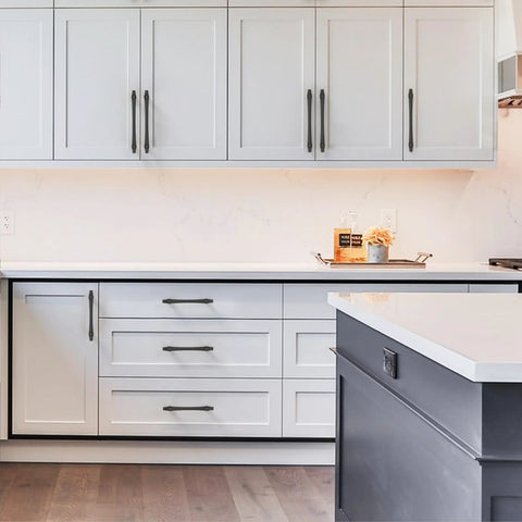 Matte Black Cabinet Pulls 5 Inch 128mm Hole Center 10 Pack Drawer Handles For Kitchen Cabinets And Bathroom Vanity Doors Hardware With Durable Construction And Easy Installation ZH0074 installed on white cabinets in kitchen setting.