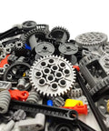 Pile of assorted gears, axles, and connectors from Tech Gear Kit With 116 Pieces For DIY Ready Builds Compatible With Mindstorms.