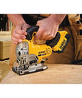 Slick 20V Max Cordless Jigsaw Kit With 4.0 Ah Battery And Fast Charger in use, cutting wood, ergonomically designed handle.